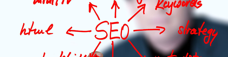 O2 REAL℠ provides transparent SEO services to each client in order to keep you informed of your online brand Red writing on a transparent board with SEO as the focal point with arrows pointing out to other areas of work with html and strategy clearly visible from O2 REAL